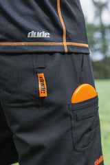 An image showing Dude Tech Caddie Shorts in black color with Left and right hand minidisc pockets